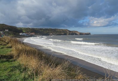 Dark clouds gathering over Sandsend A day of sunshine and showers, pictured with an incoming tide